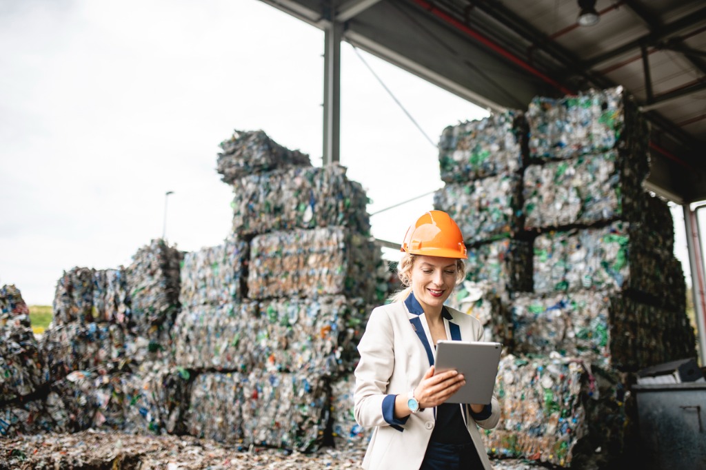 recycling worker using technology